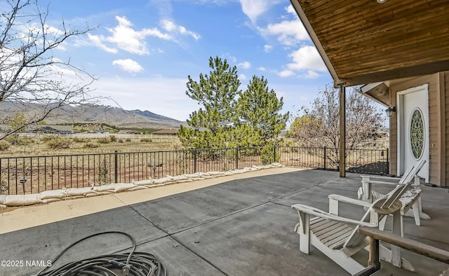 11267 N Lilac Ln, Flagstaff, AZ 86004 - fenced backyard featuring a mountain view and a patio area