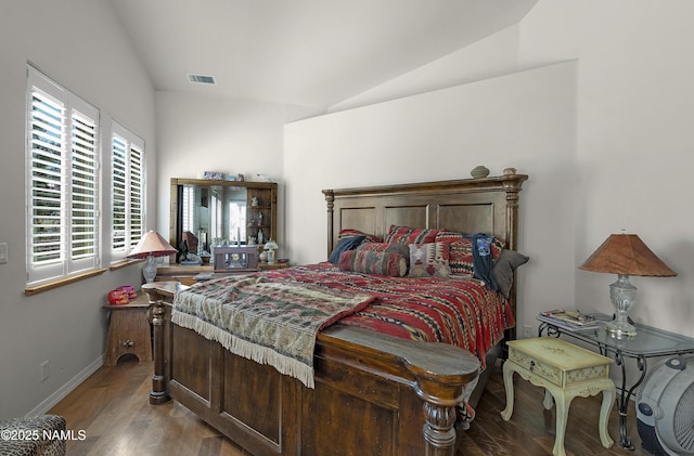 11267 N Lilac Ln, Flagstaff, AZ 86004 - bedroom with lofted ceiling, wood finished floors, and baseboards