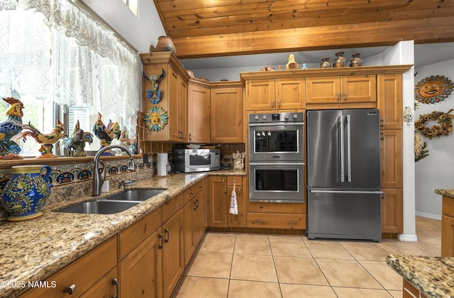 11267 N Lilac Ln, Flagstaff, AZ 86004 - kitchen with stainless steel appliances, a sink, brown cabinets, wooden ceiling, and light tile patterned floors
