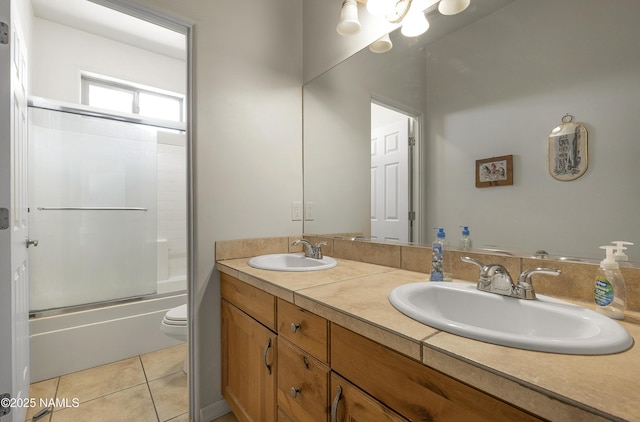 11267 N Lilac Ln, Flagstaff, AZ 86004 - full bath featuring double vanity, enclosed tub / shower combo, toilet, and tile patterned flooring