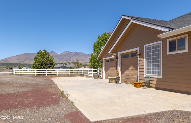 11267 N Lilac Ln, Flagstaff, AZ 86004 - view of patio featuring a mountain view and concrete driveway