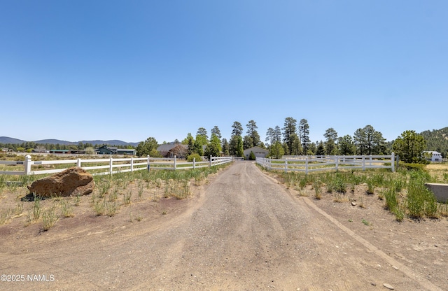 11267 N Lilac Ln, Flagstaff, AZ 86004 - view of dirt / gravel driveway with a view of countryside and a mountain view