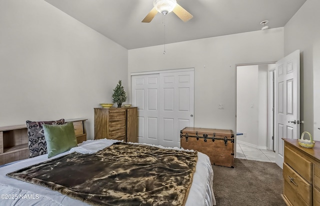 11267 N Lilac Ln, Flagstaff, AZ 86004 - tiled bedroom featuring carpet floors, a closet, a ceiling fan, and baseboards