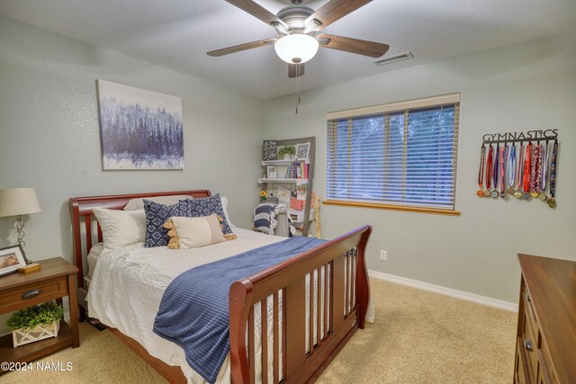 carpeted bedroom with ceiling fan