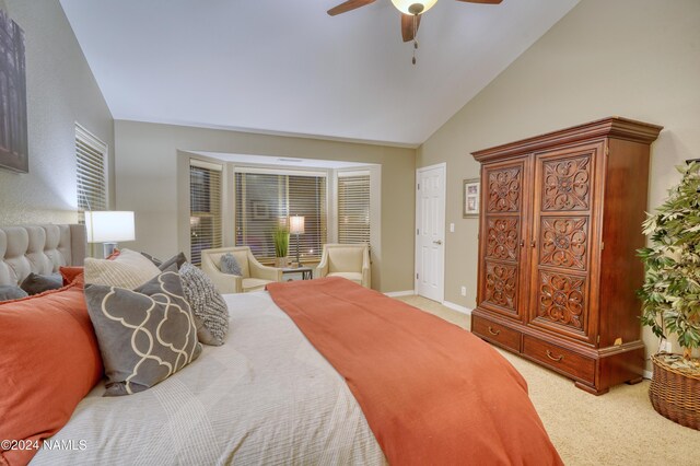 bedroom with lofted ceiling, carpet floors, and ceiling fan