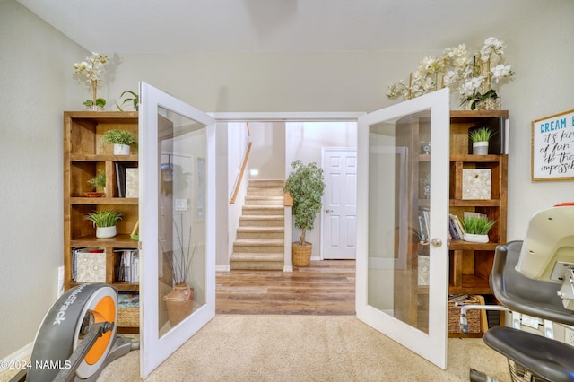 interior space featuring light carpet and french doors