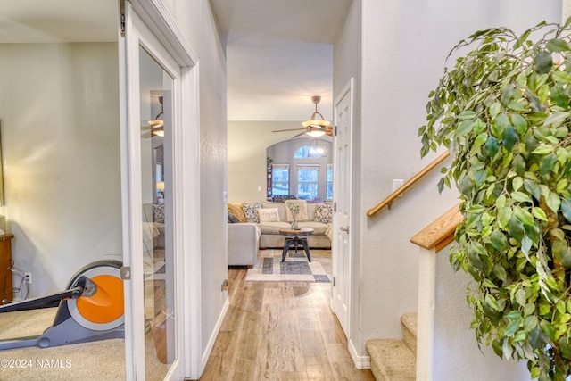 hall with hardwood / wood-style floors