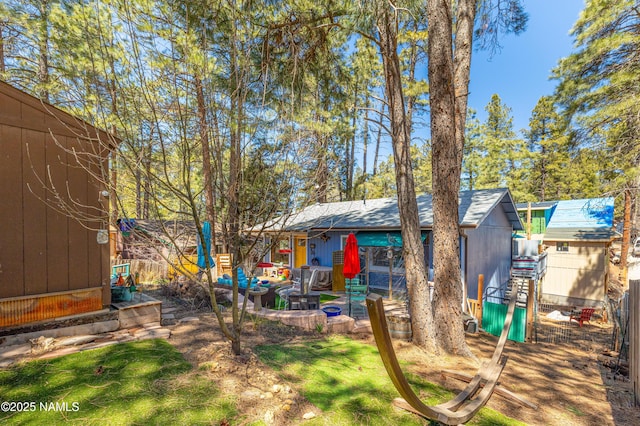 exterior space with a yard and fence