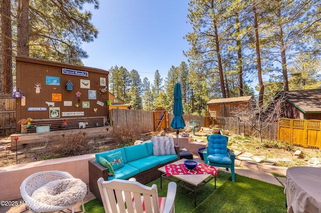 view of patio / terrace with outdoor lounge area and fence