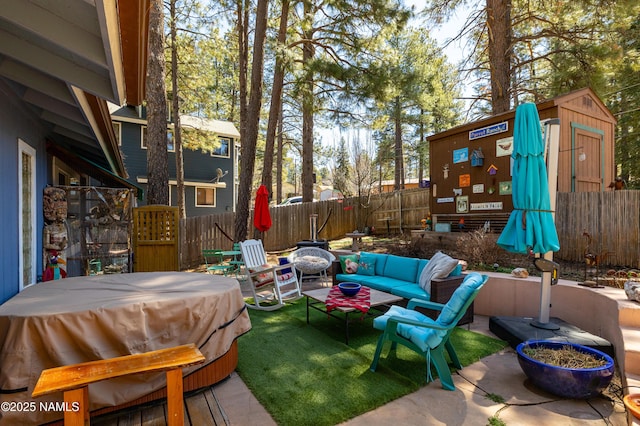 view of patio with an outdoor living space and fence