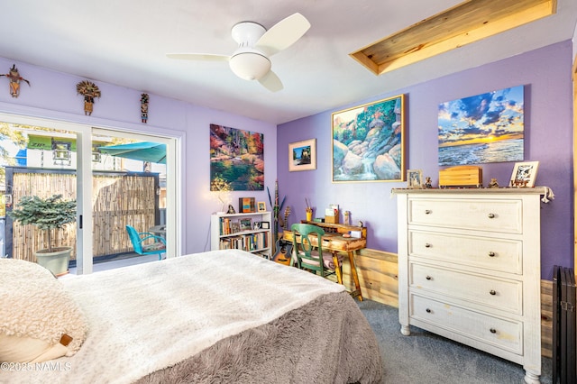 carpeted bedroom featuring ceiling fan and access to exterior