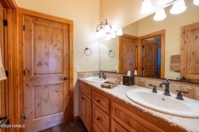 bathroom with vanity and tasteful backsplash