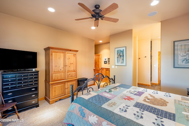 bedroom with light carpet and ceiling fan