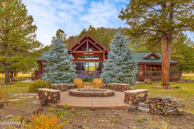 exterior space with a fire pit