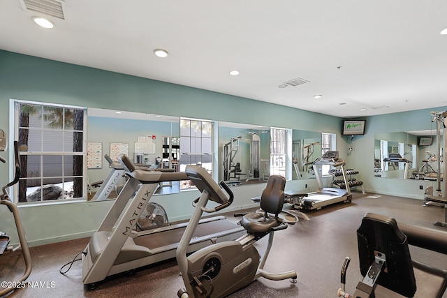 exercise room featuring recessed lighting and baseboards