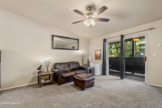 carpeted living area featuring vaulted ceiling, a ceiling fan, and baseboards