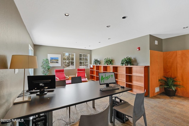 carpeted office with recessed lighting
