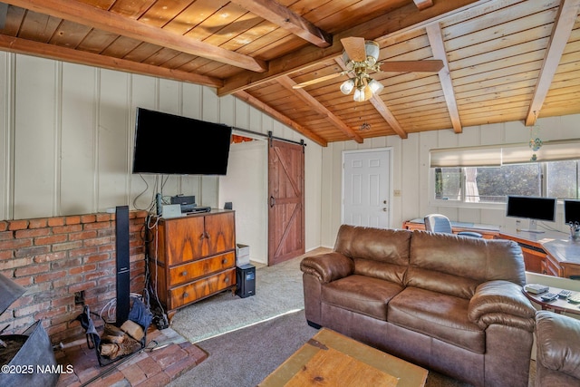 carpeted living room with a barn door, wooden ceiling, and ceiling fan
