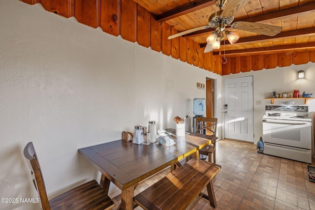 dining room featuring beamed ceiling, brick patterned floor, a ceiling fan, and wooden ceiling