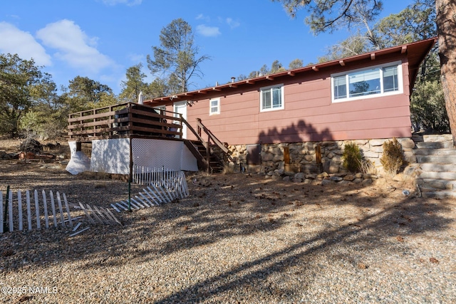 back of house with stairway and a wooden deck