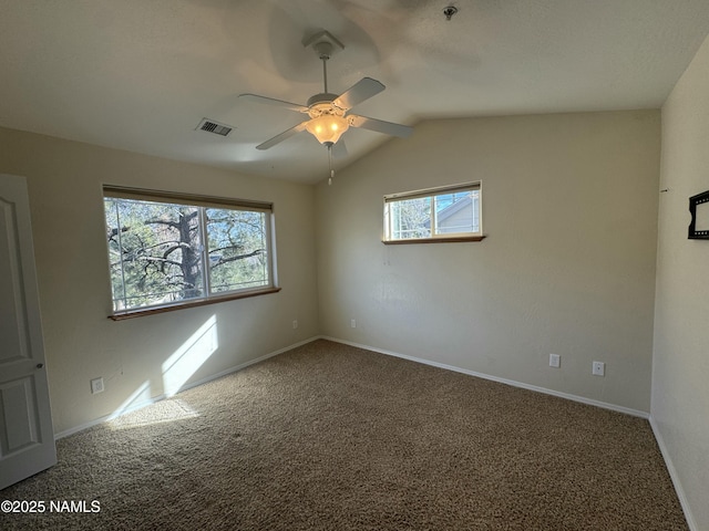 unfurnished room with vaulted ceiling, carpet, and ceiling fan