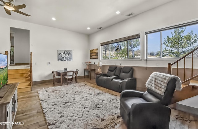 8841 E Rolling Thunder Dr, Flagstaff, AZ 86004 - living room with stairway, recessed lighting, light wood-style flooring, a ceiling fan, and baseboards