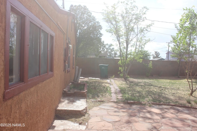 322 W Mahoney St, Winslow, AZ 86047 - fenced backyard featuring a patio area