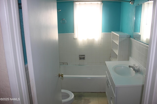 322 W Mahoney St, Winslow, AZ 86047 - full bath with tile walls, vanity, toilet, tile patterned flooring, and a wainscoted wall