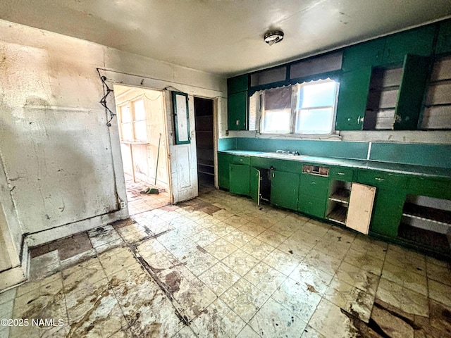 216 W 3rd St, Winslow, AZ 86047 - kitchen with green cabinets and light flooring