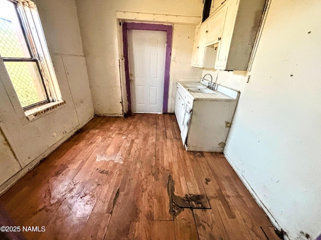 216 W 3rd St, Winslow, AZ 86047 - washroom with light wood-style floors and a sink