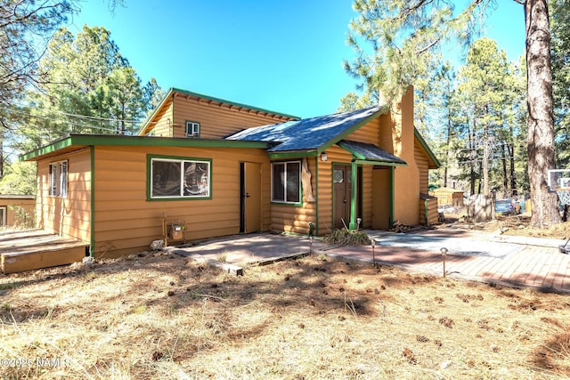 back of property with a patio area