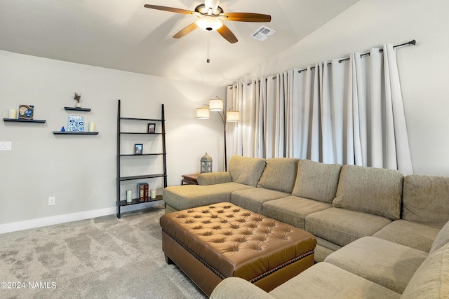 carpeted living room featuring vaulted ceiling and ceiling fan