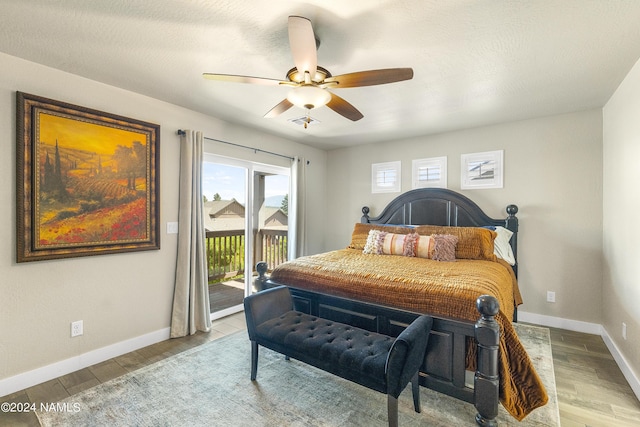 bedroom featuring ceiling fan, access to exterior, and light wood-type flooring