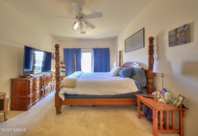 carpeted bedroom with a ceiling fan