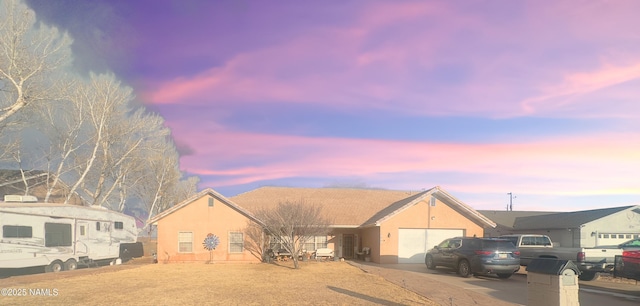 single story home with a garage