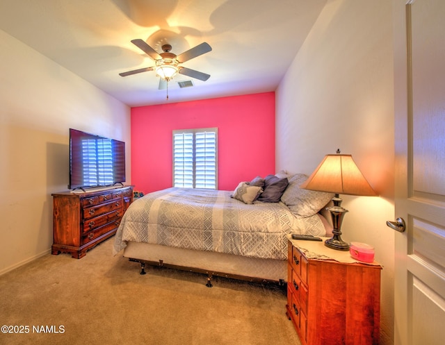 bedroom featuring carpet floors, visible vents, and a ceiling fan