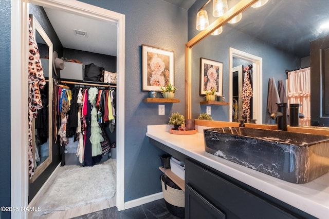 bathroom featuring vanity and tile patterned flooring