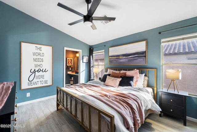 bedroom featuring ceiling fan, multiple windows, vaulted ceiling, and light wood-type flooring