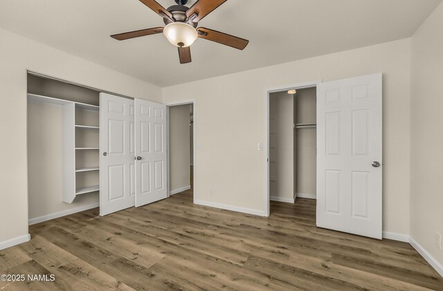 9835 Pioneer Valley Rd, Flagstaff, AZ 86004 - unfurnished bedroom featuring wood finished floors and baseboards