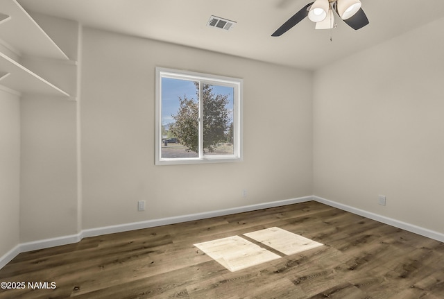9835 Pioneer Valley Rd, Flagstaff, AZ 86004 - spare room with wood finished floors, a ceiling fan, and baseboards