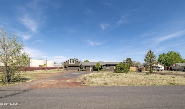 9835 Pioneer Valley Rd, Flagstaff, AZ 86004 - view of front of property with asphalt driveway and an attached garage