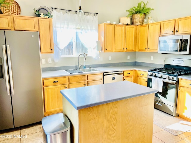 11677 W Cove Crest Dr, Bellemont, AZ 86015 - kitchen featuring stainless steel appliances, a sink, light brown cabinetry, light tile patterned floors, and a kitchen island