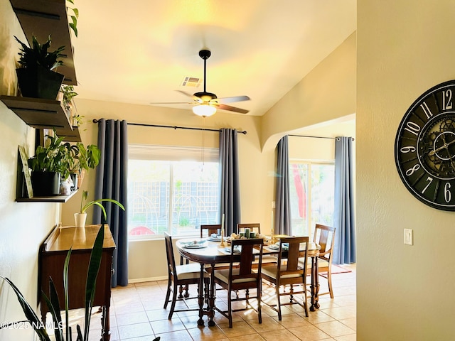 11677 W Cove Crest Dr, Bellemont, AZ 86015 - dining area featuring ceiling fan, light tile patterned floors, plenty of natural light, and vaulted ceiling