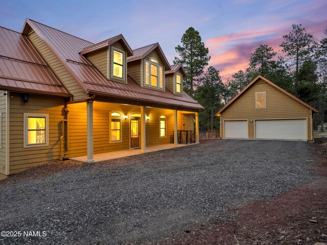 284 E Foothill Trl, Williams, AZ 86046 - view of front of home featuring a detached garage, an outbuilding, metal roof, and covered porch