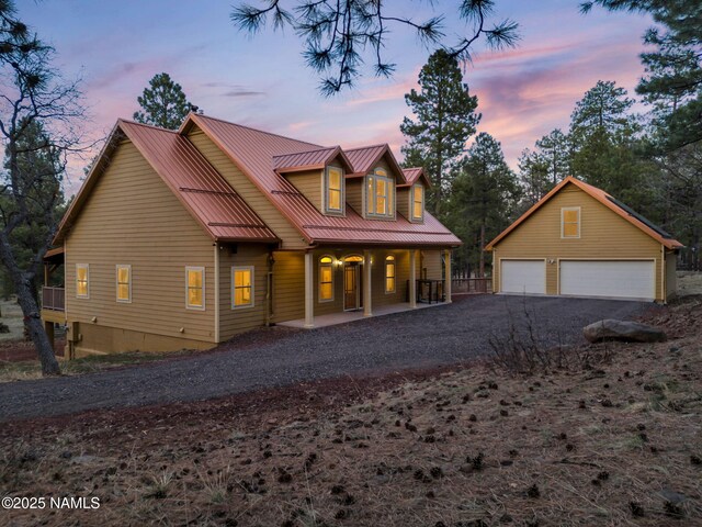 284 E Foothill Trl, Williams, AZ 86046 - chalet / cabin featuring a garage, an outdoor structure, a porch, and metal roof