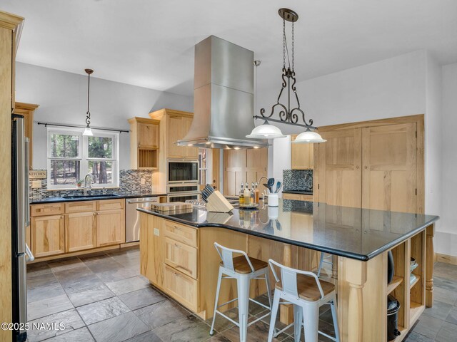 284 E Foothill Trl, Williams, AZ 86046 - kitchen with decorative backsplash, light brown cabinets, island exhaust hood, a sink, and stainless steel appliances