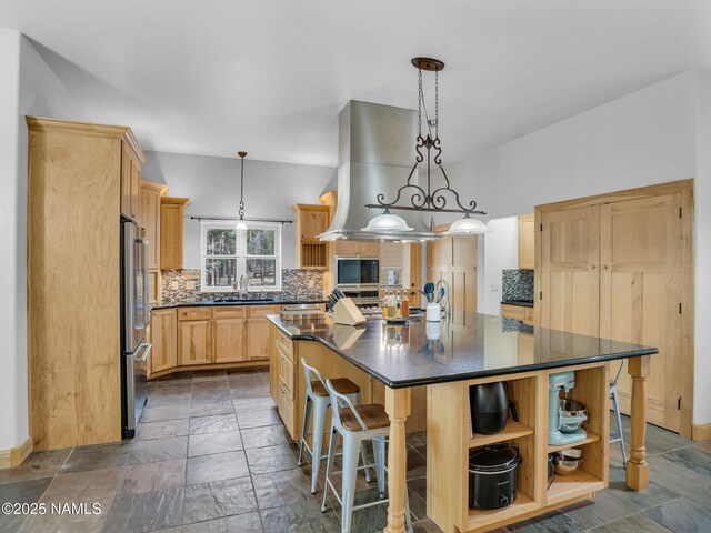 284 E Foothill Trl, Williams, AZ 86046 - kitchen with stainless steel fridge, a sink, tasteful backsplash, and stone tile flooring