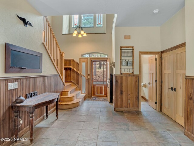 284 E Foothill Trl, Williams, AZ 86046 - foyer entrance featuring stone tile floors, wainscoting, and stairs