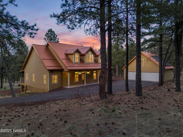 284 E Foothill Trl, Williams, AZ 86046 - chalet / cabin featuring a garage, covered porch, and metal roof