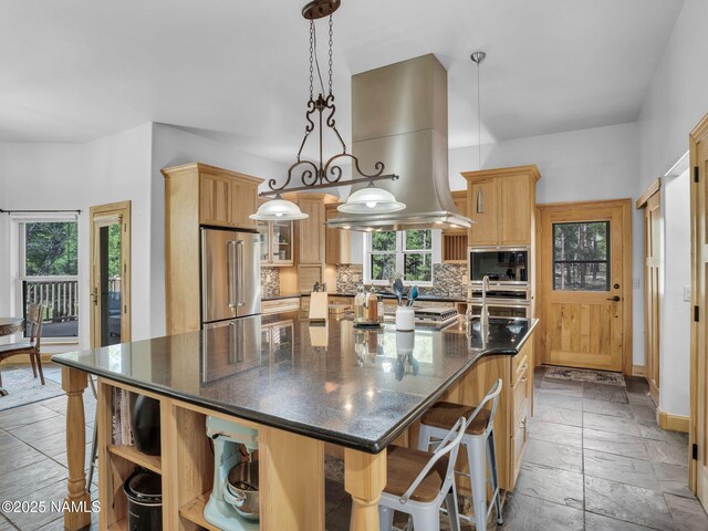 284 E Foothill Trl, Williams, AZ 86046 - kitchen with backsplash, island exhaust hood, open shelves, glass insert cabinets, and stainless steel appliances